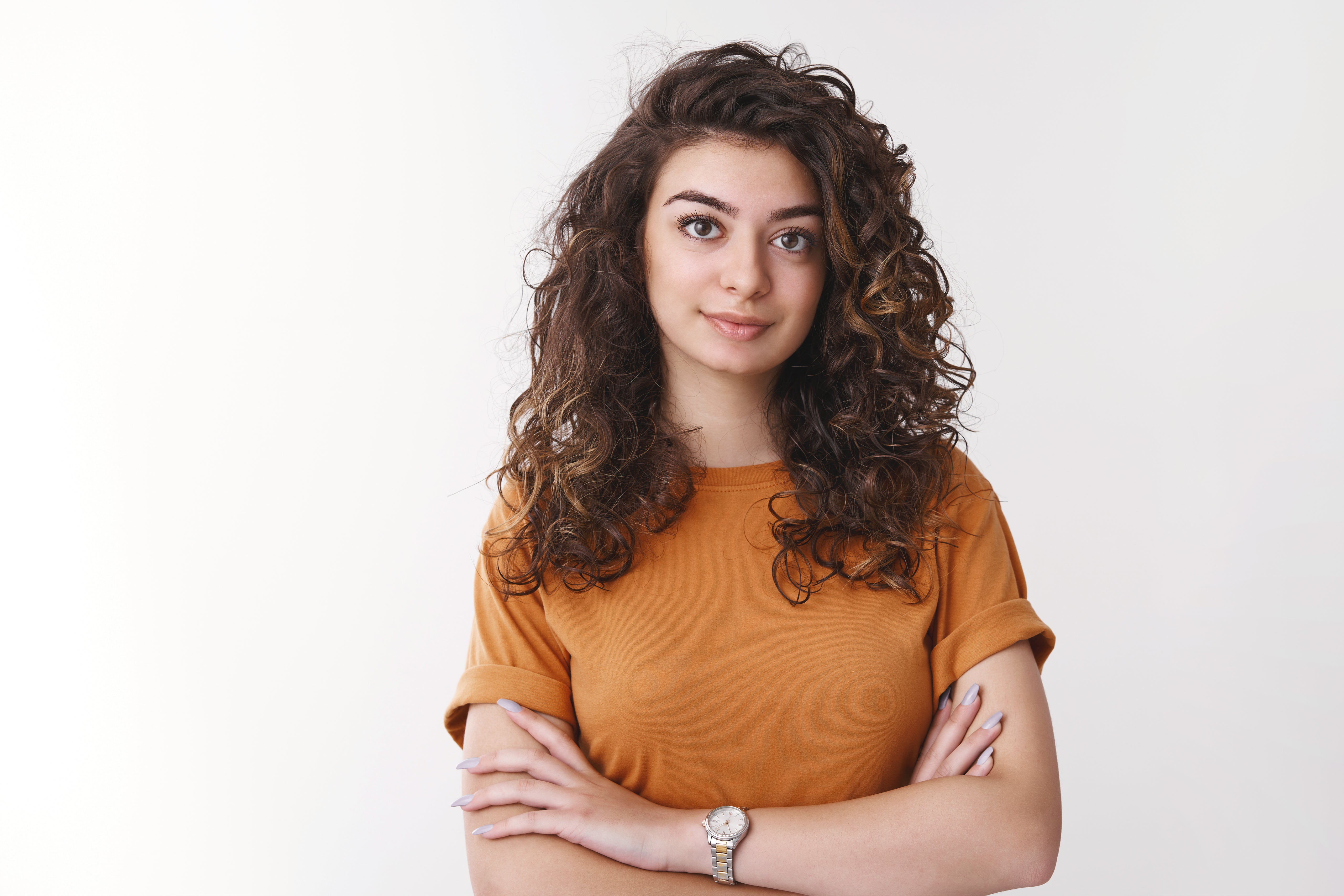 files/young-determined-armenian-curlyhaired-female-university-student-listen-carefully-asignment-look-confident-ready-task-cross-hands-chest-smiling-selfassured-standing-white-background.jpg